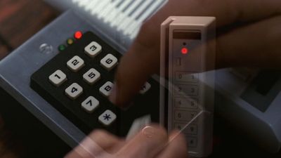 Film still from 'X-periments' (2024) by Jon Beaton. An image of someone inputting a code into a number pad with a red LED on it is overlaid with an image of someone swiping a card through a card reader with a red LED on it.
